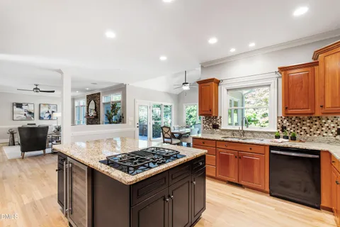 a dining room with furniture window and wooden floor