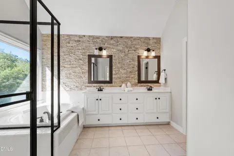 a view of a chandelier fan and entryway