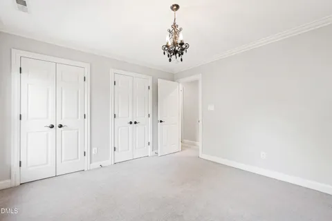 a view of a livingroom with a ceiling fan and window