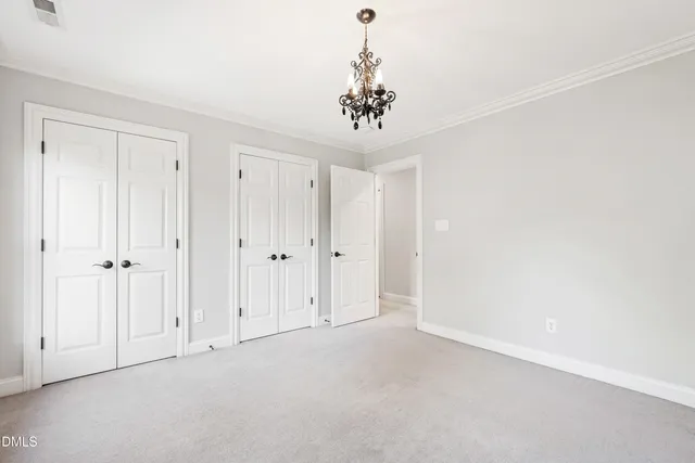 a view of a livingroom with a ceiling fan and window
