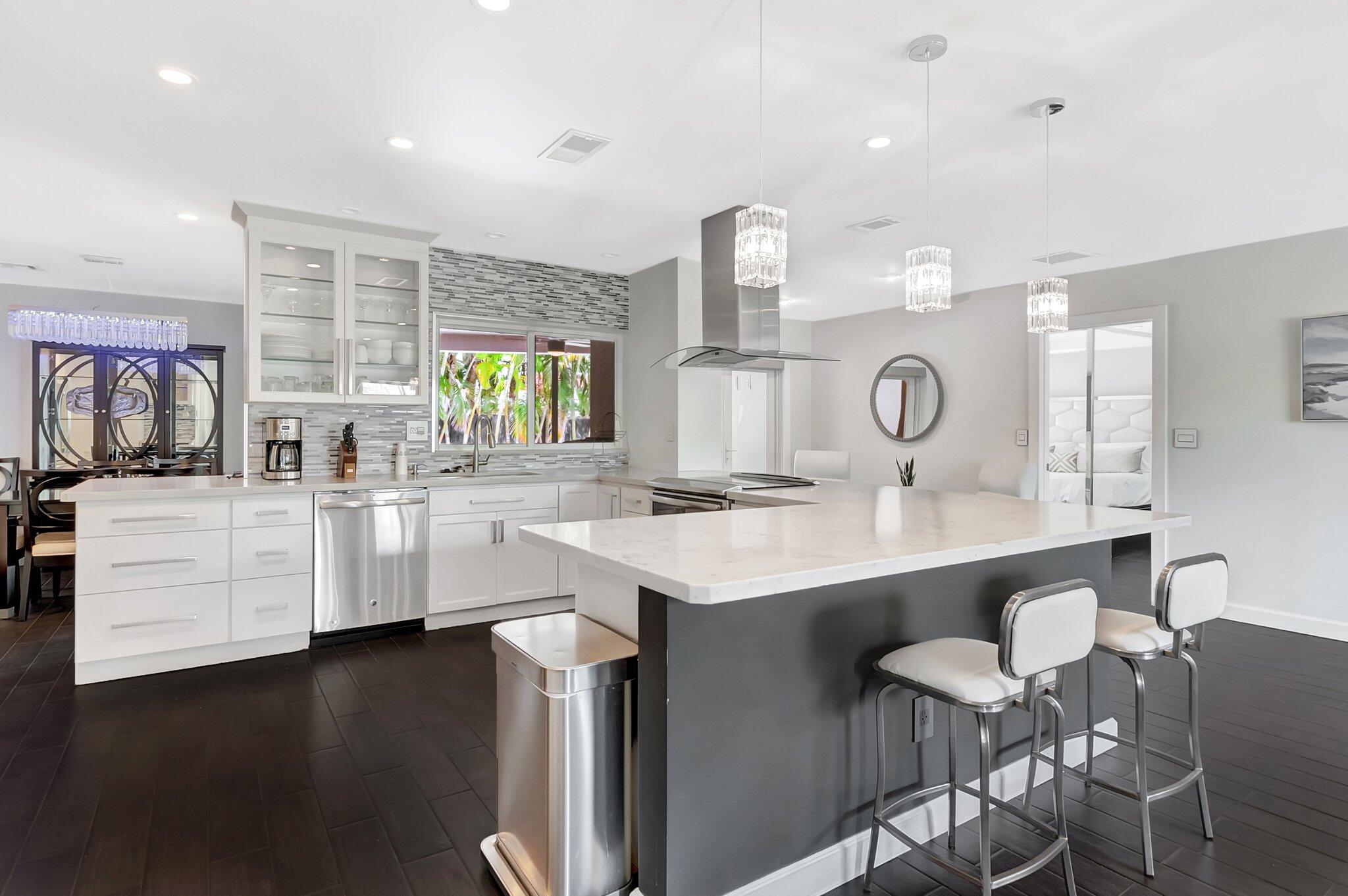 855 Berkley Street Boca Raton, FL 33487 - Photo 11 of 34 a kitchen with counter top space cabinets and appliances