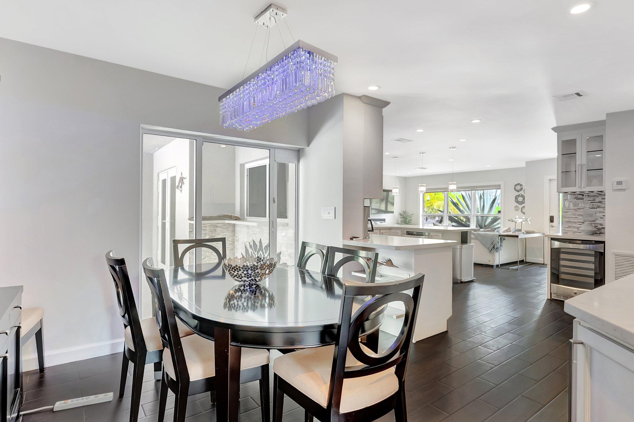 855 Berkley Street Boca Raton, FL 33487 - Photo 15 of 34 a view of a dining room with furniture and wooden floor