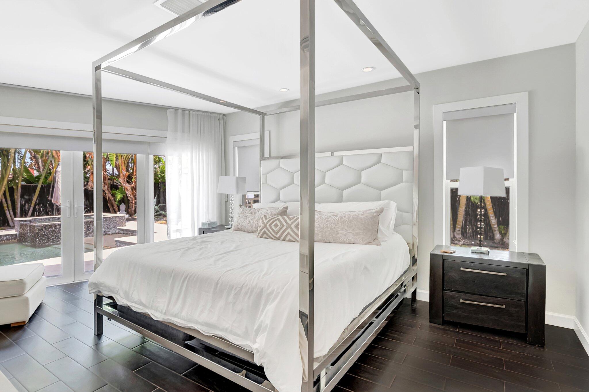 855 Berkley Street Boca Raton, FL 33487 - Photo 16 of 34 a bedroom with a bed and a couch