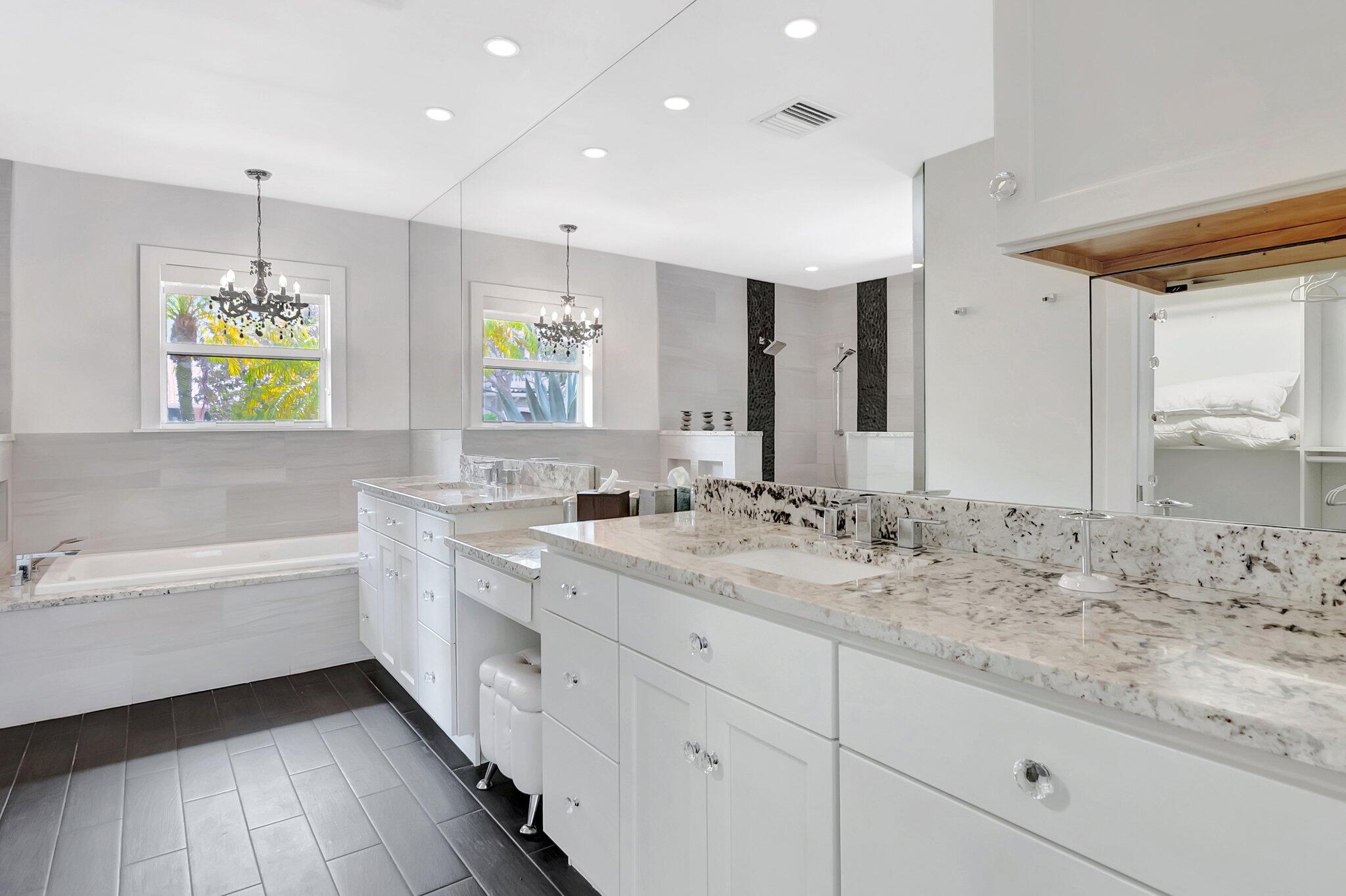 855 Berkley Street Boca Raton, FL 33487 - Photo 17 of 34 a bathroom with a granite countertop sink mirror and bathtub