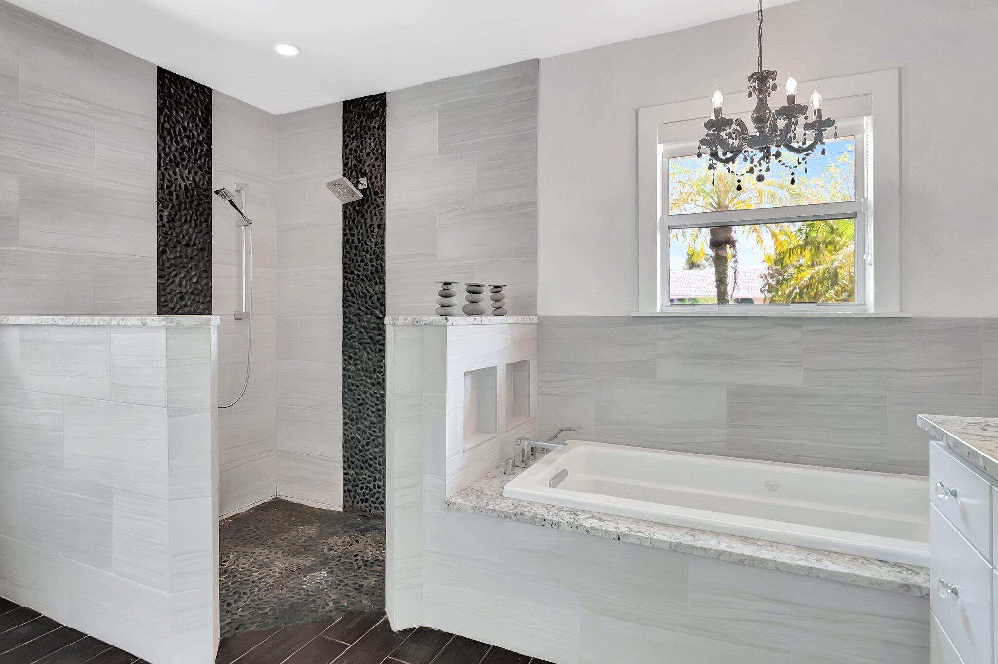 855 Berkley Street Boca Raton, FL 33487 - Photo 18 of 34 a bathroom with a tub and a shower