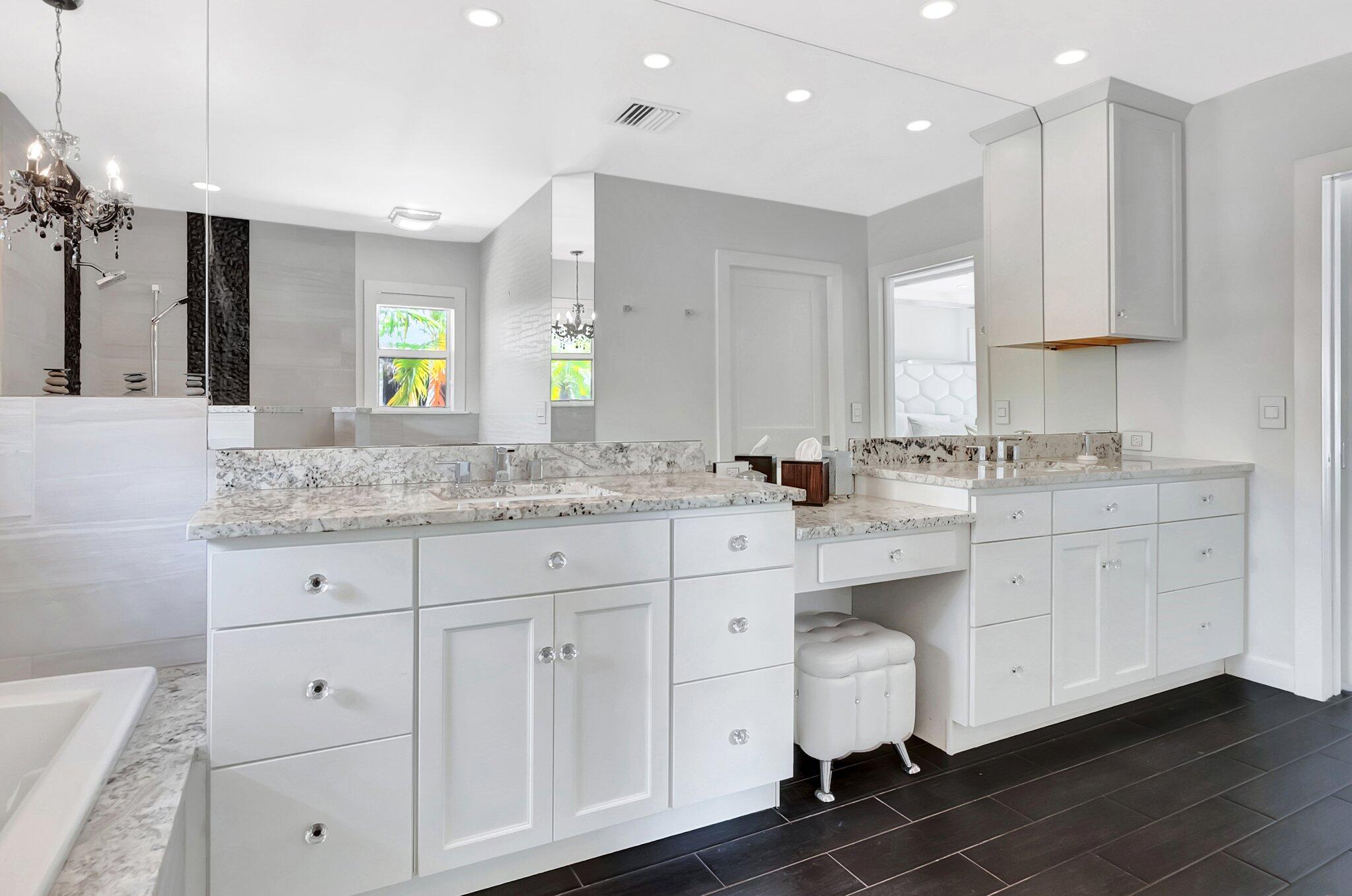 855 Berkley Street Boca Raton, FL 33487 - Photo 19 of 34 a bathroom with a granite countertop sink mirror and cabinets