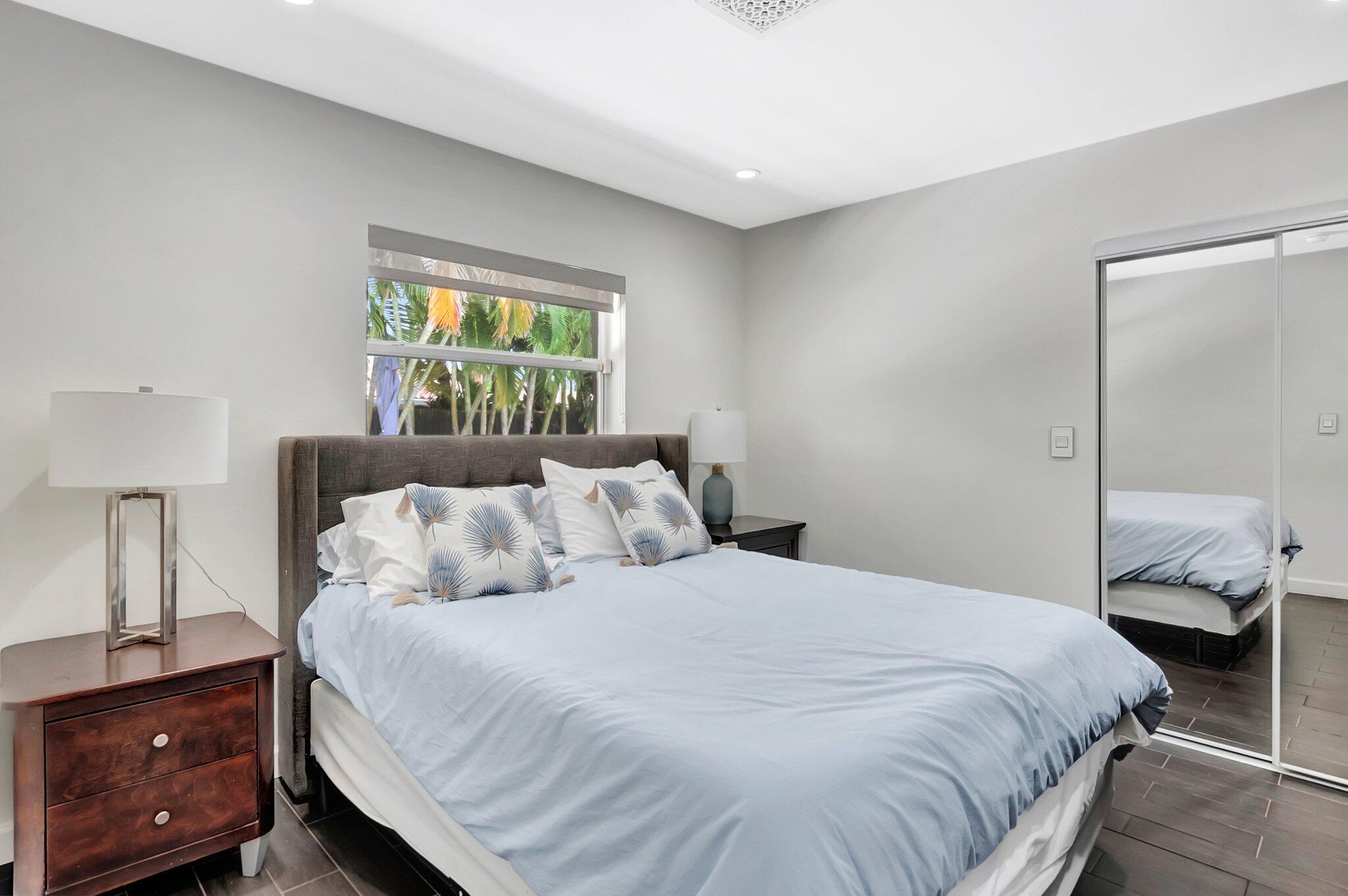855 Berkley Street Boca Raton, FL 33487 - Photo 21 of 34 a bedroom with a bed and a window