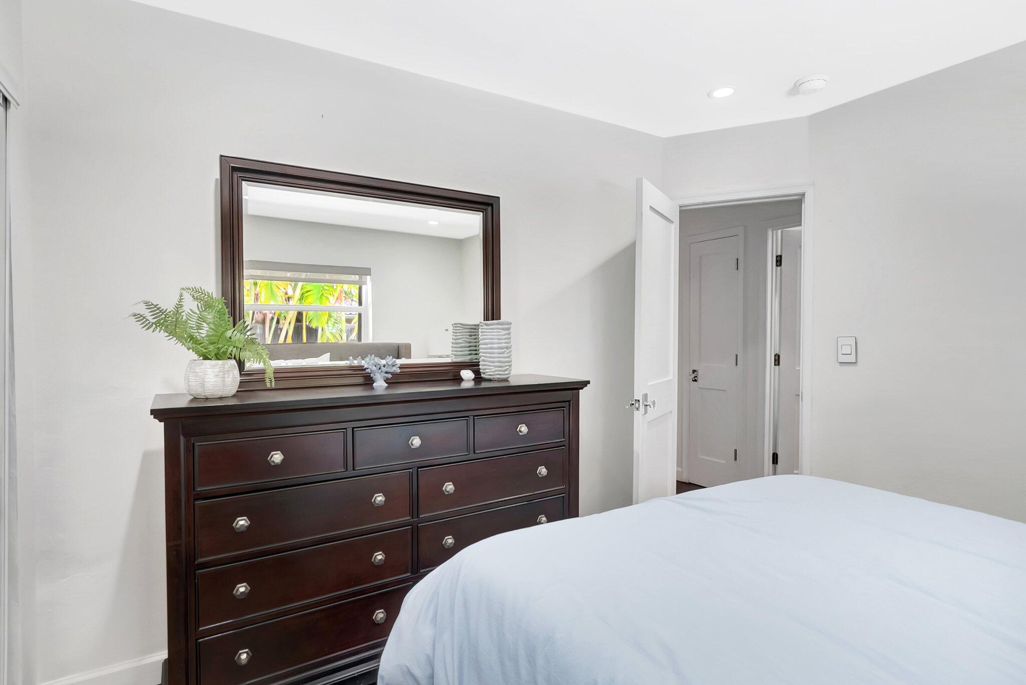 855 Berkley Street Boca Raton, FL 33487 - Photo 22 of 34 a bedroom with a bed and a dresser
