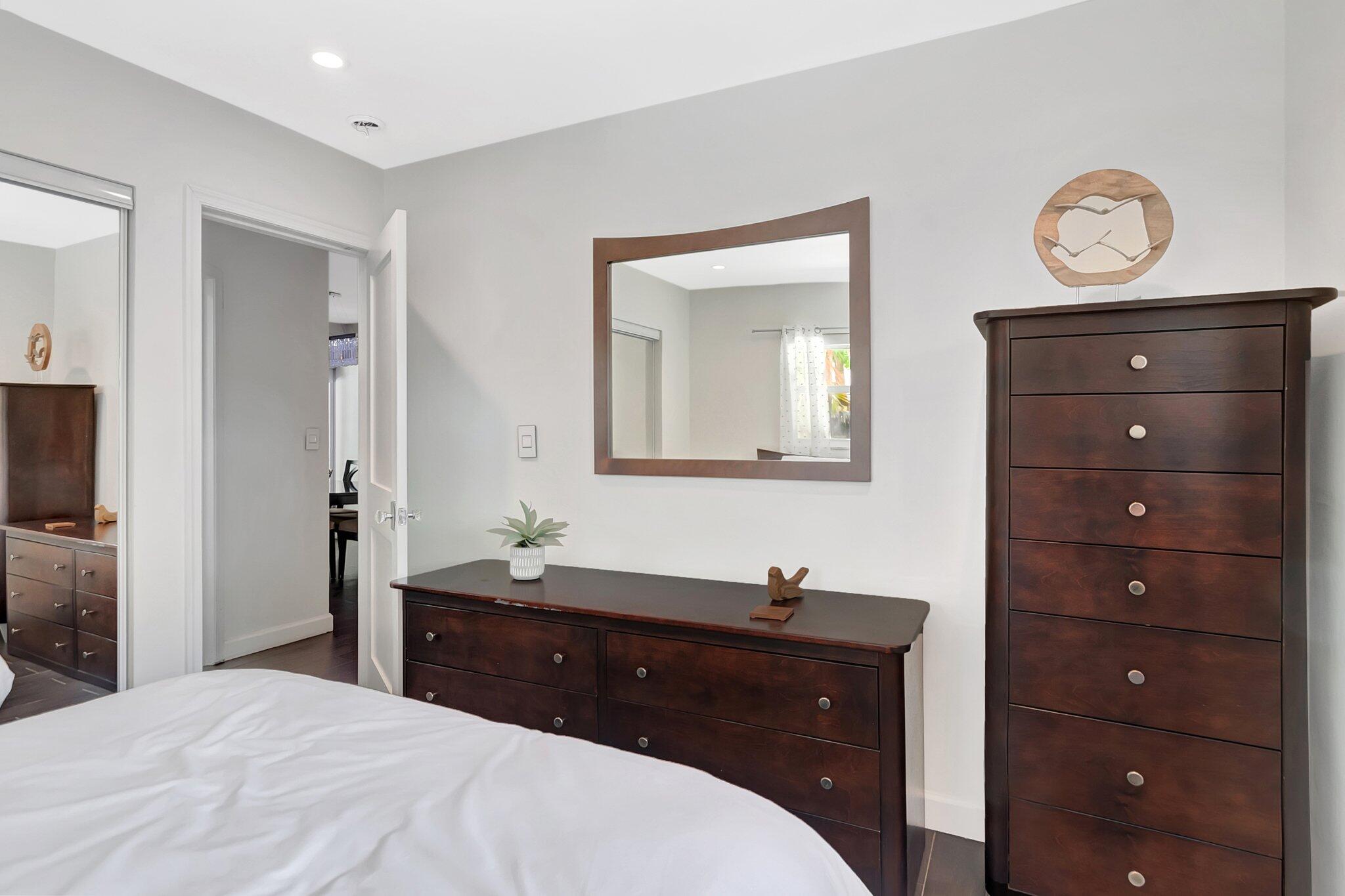 855 Berkley Street Boca Raton, FL 33487 - Photo 25 of 34 a bedroom with a bed and a dresser