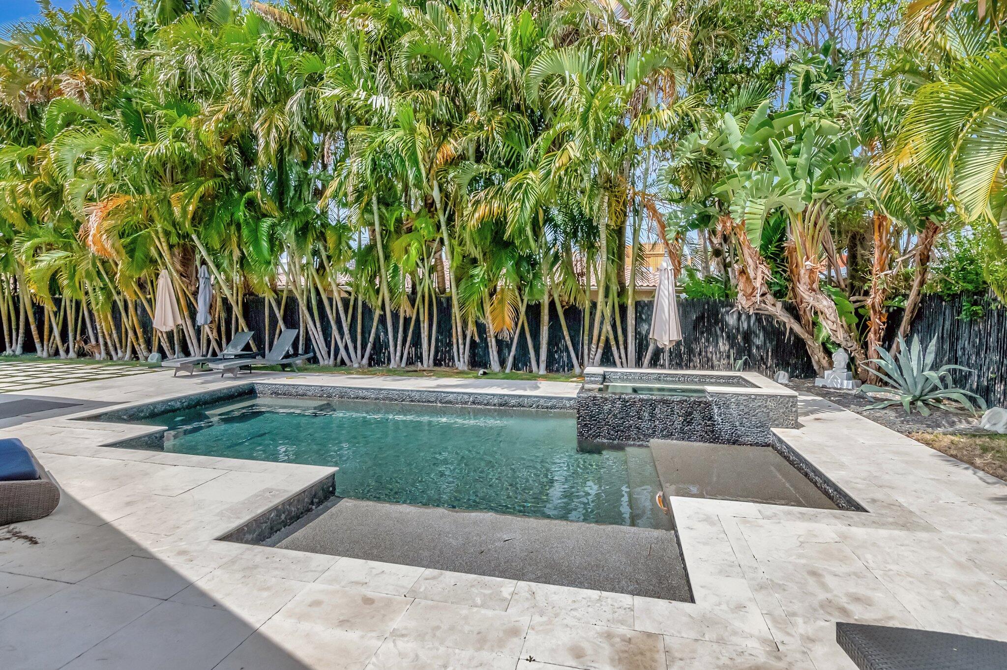 855 Berkley Street Boca Raton, FL 33487 - Photo 31 of 34 front view of a house with a yard