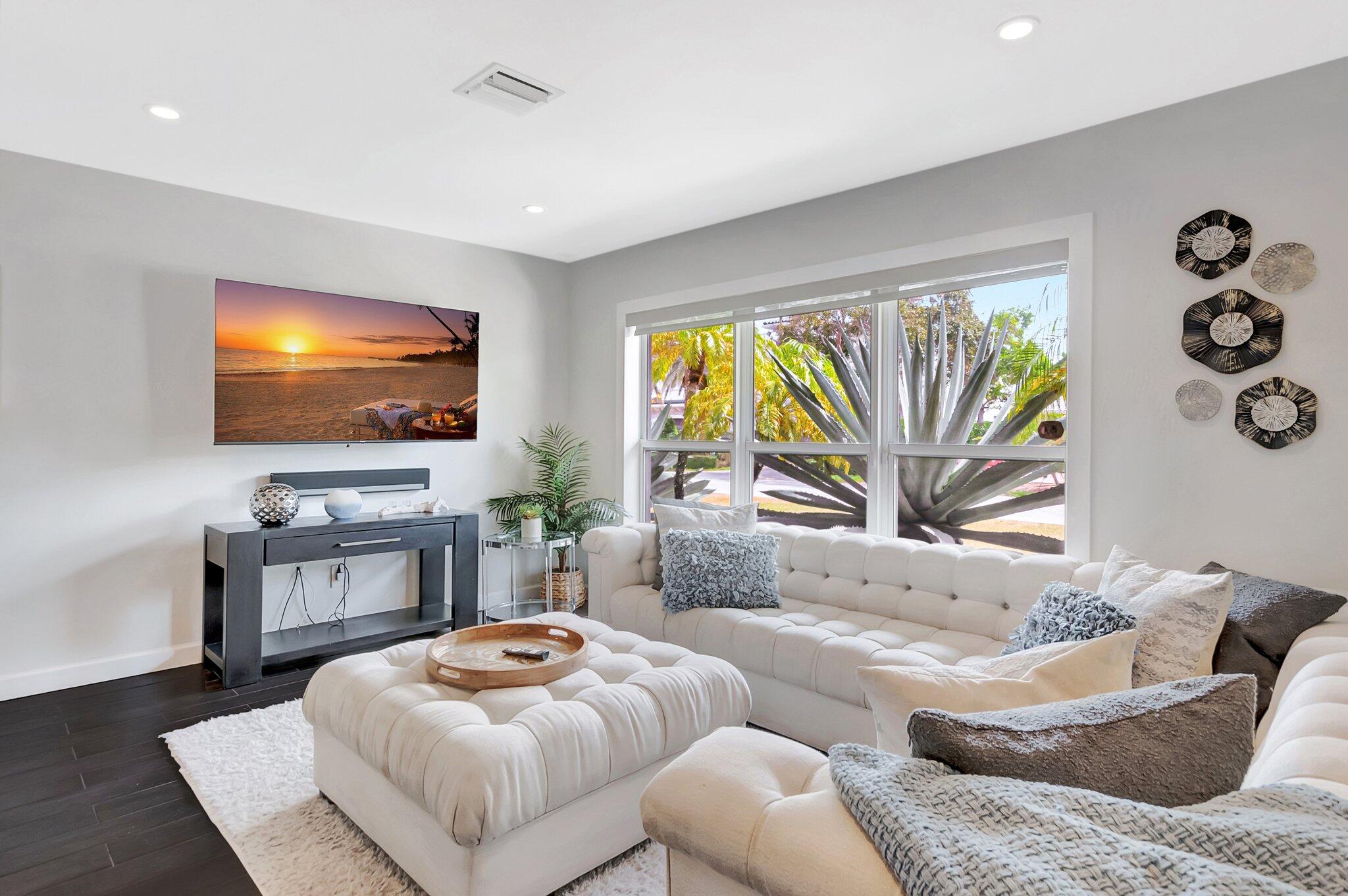 855 Berkley Street Boca Raton, FL 33487 - Photo 5 of 34 a living room with furniture and a flat screen tv