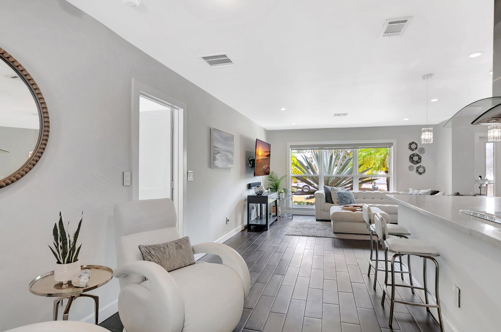 855 Berkley Street Boca Raton, FL 33487 - Photo 7 of 34 a living room with furniture and a large window