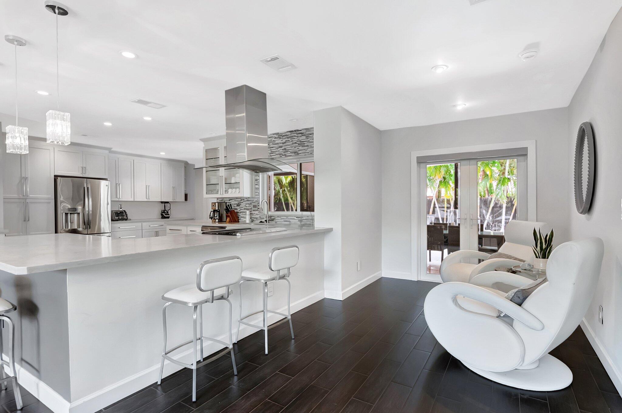855 Berkley Street Boca Raton, FL 33487 - Photo 9 of 34 a living room with furniture a window and appliances