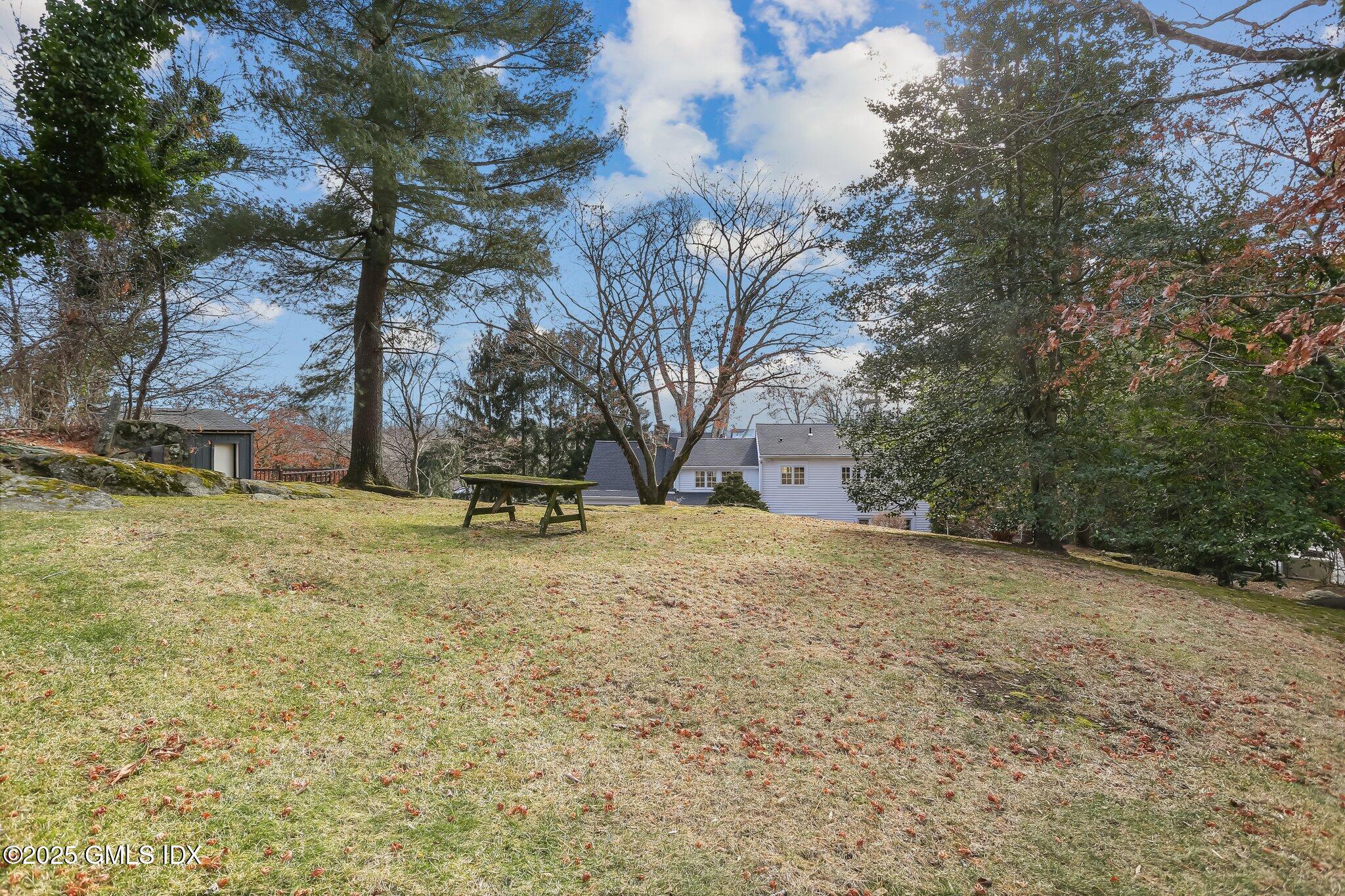 3 Cat Rock Road Cos Cob, CT 06807 - Photo 47 of 49 a house with trees in front of it
