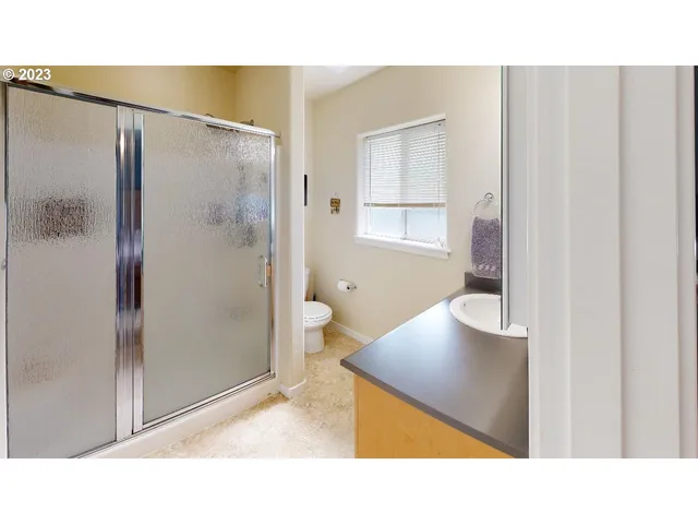 a bathroom with a sink a mirror and a window