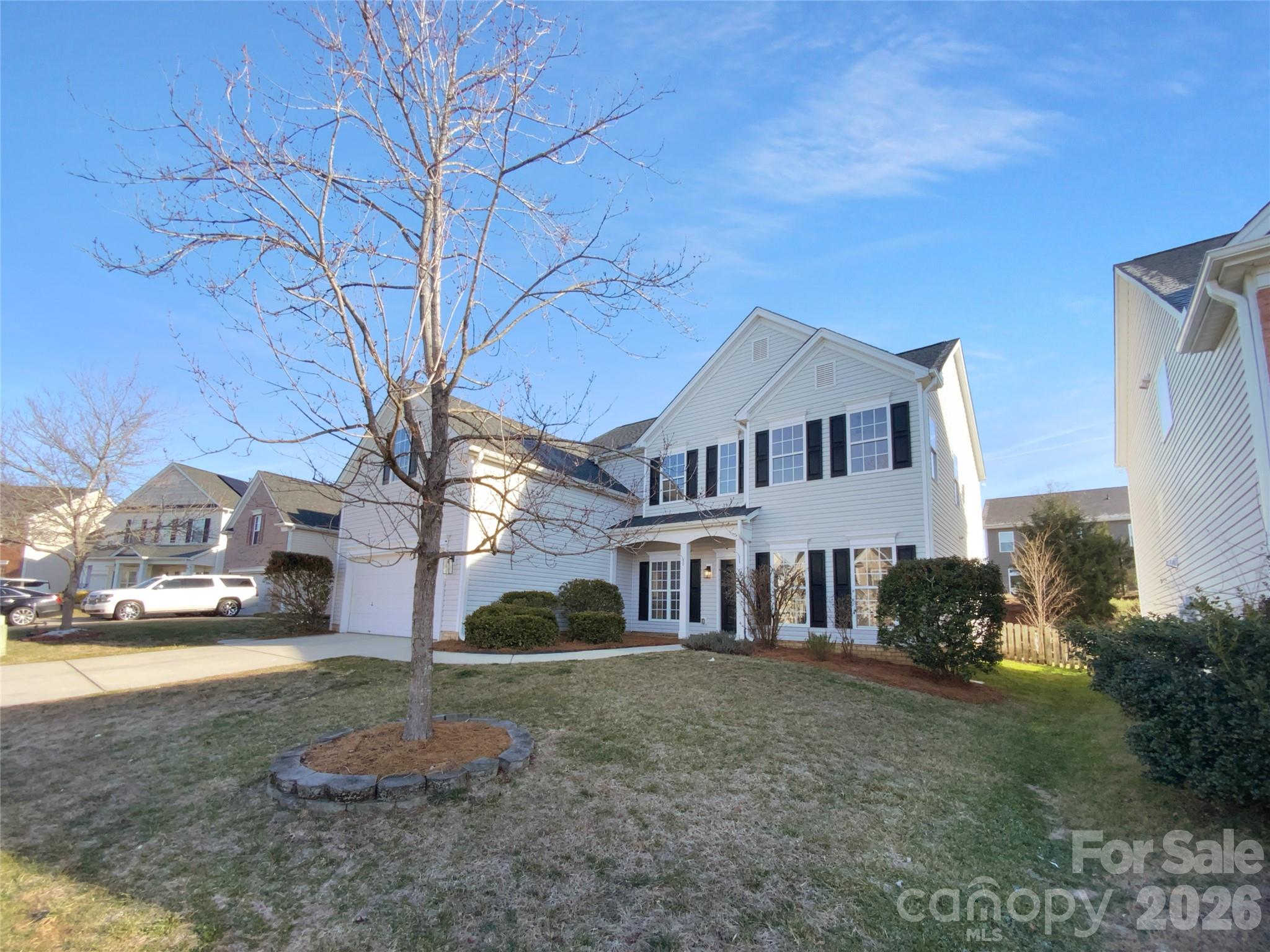 9676 Ravenscroft Lane Northwest Concord, NC 28027 - Photo 21 of 23 a front view of a house with a yard