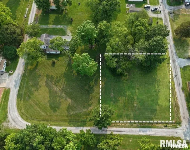an aerial view of a residential houses with outdoor space and swimming pool