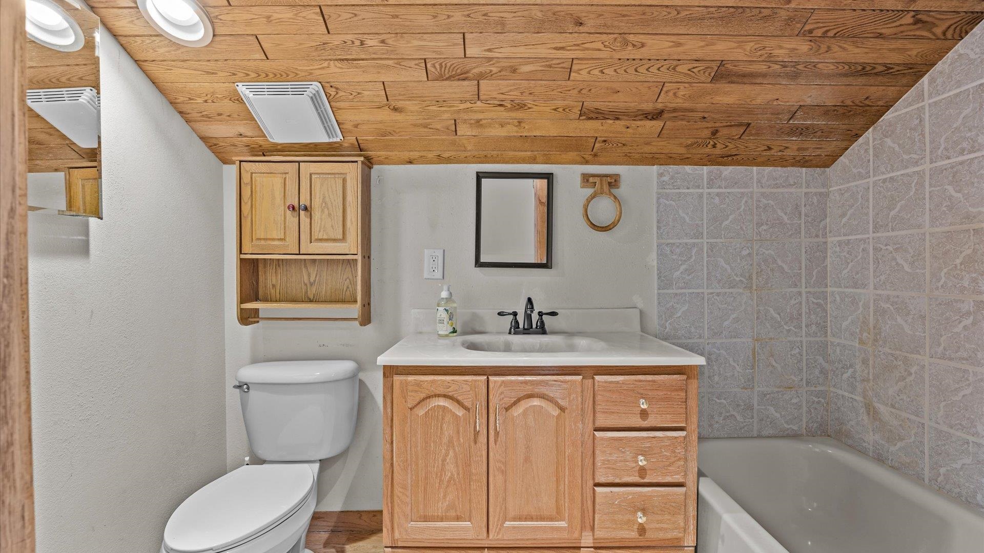 2737 Six Lazy K Road Silt, CO 81652 - Photo 36 of 42 a bathroom with a granite countertop toilet sink and mirror