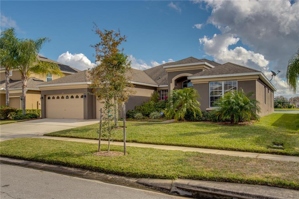 1716 Boat Launch Road Kissimmee, FL 34746 - Photo 1 of 1 a front view of a house with garden