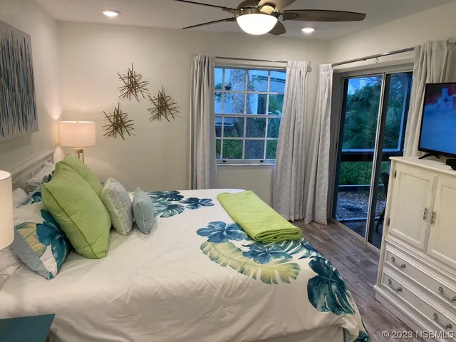 a bed room with a bed and a window