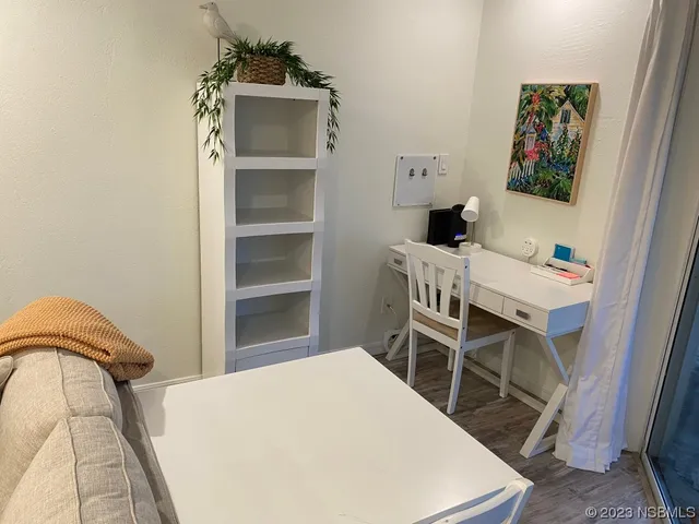 a bedroom with a bed and a table in it
