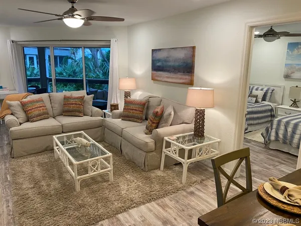 a living room with furniture and a window