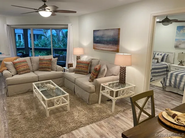 a living room with furniture and a window