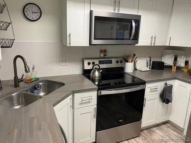 a kitchen with a stove and a microwave