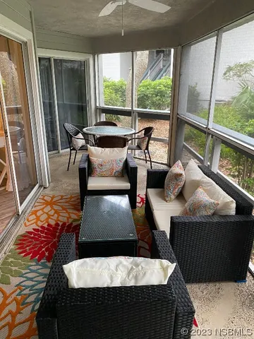 a living room with furniture and a rug