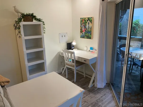 a bed room with a bed and a desk