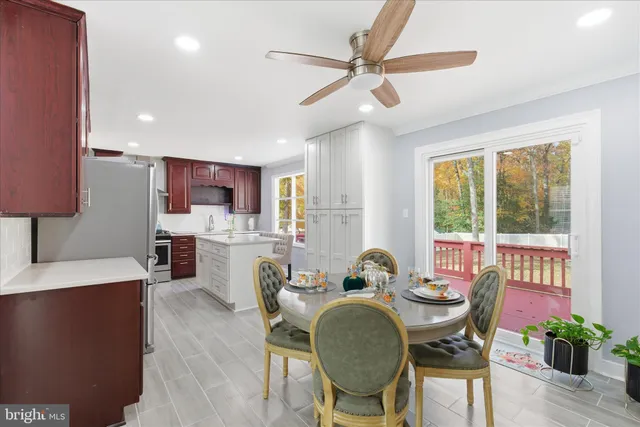 a view of a dining room with furniture window and outside view