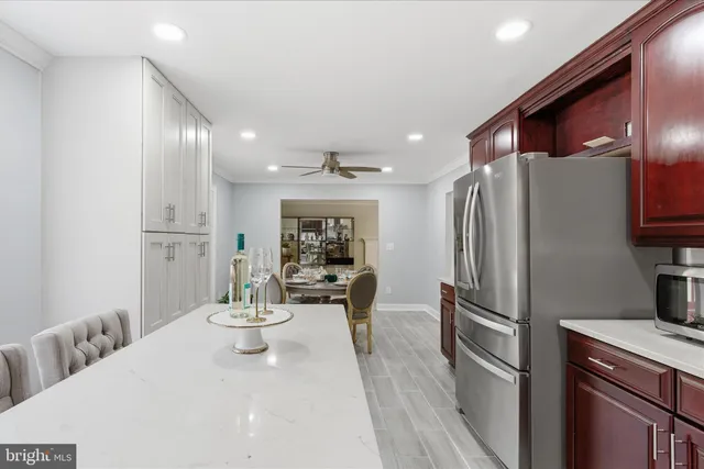 a kitchen with stainless steel appliances a refrigerator and a stove