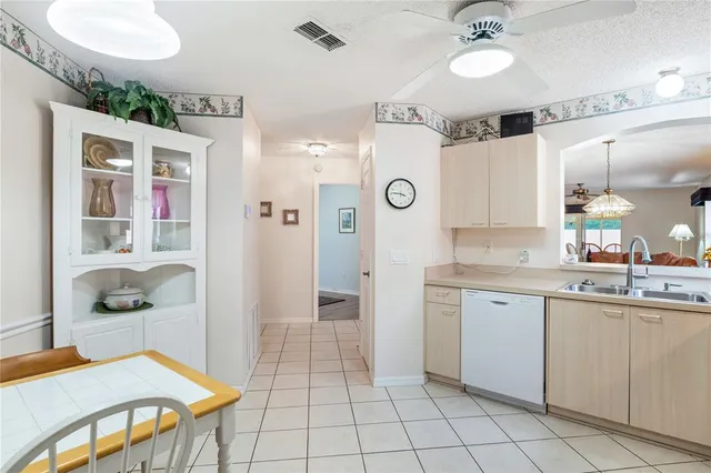 a spacious bathroom with a sink a mirror and a shower