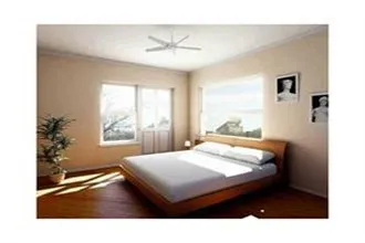 a bedroom with a bed window and a chandelier