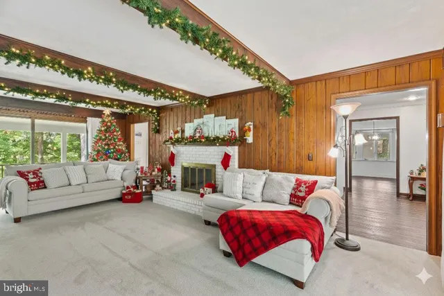 a bedroom with furniture and a large window