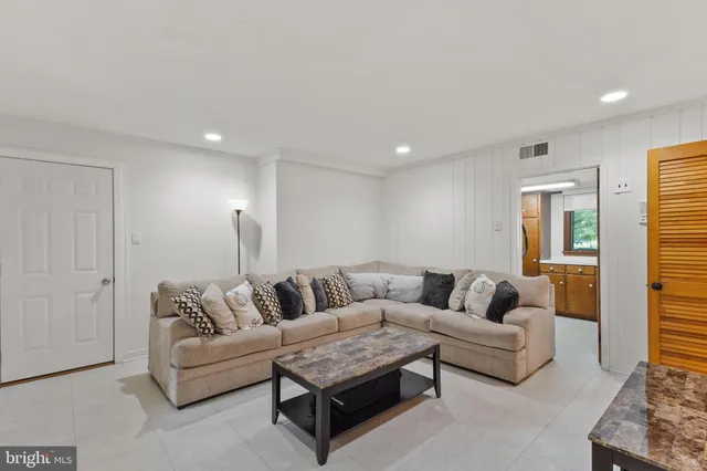 a living room with furniture and a couch