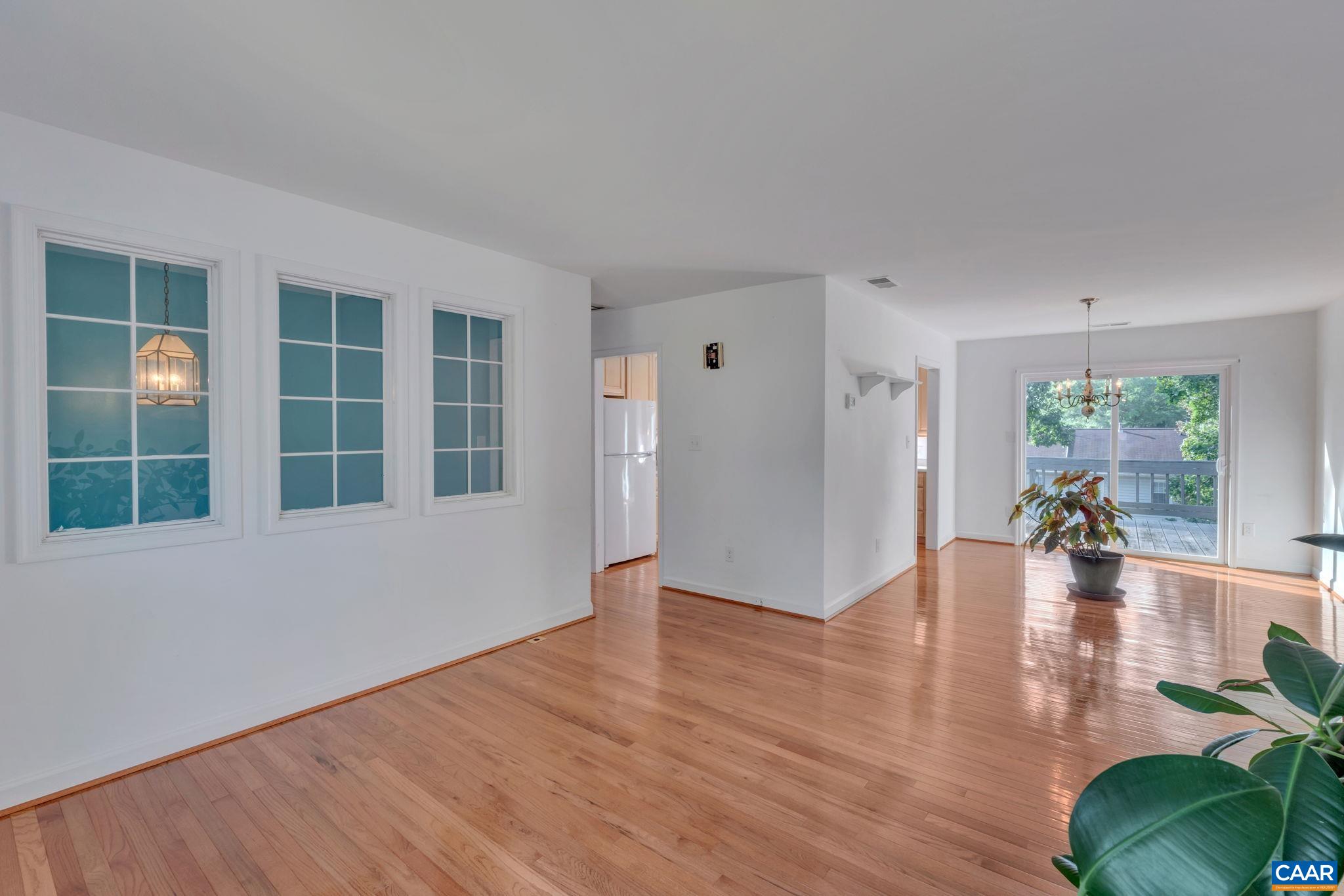 392 Minor Ridge Road Charlottesville, VA 22901 - Photo 11 of 47 a view of empty room with wooden floor and windows