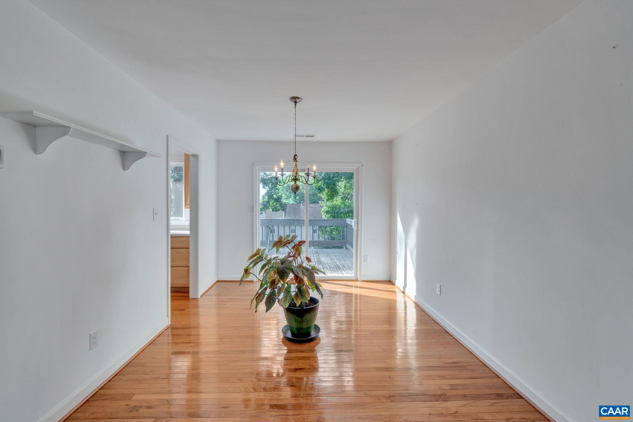 392 Minor Ridge Road Charlottesville, VA 22901 - Photo 12 of 47 a hallway with a flower pot and view of living room
