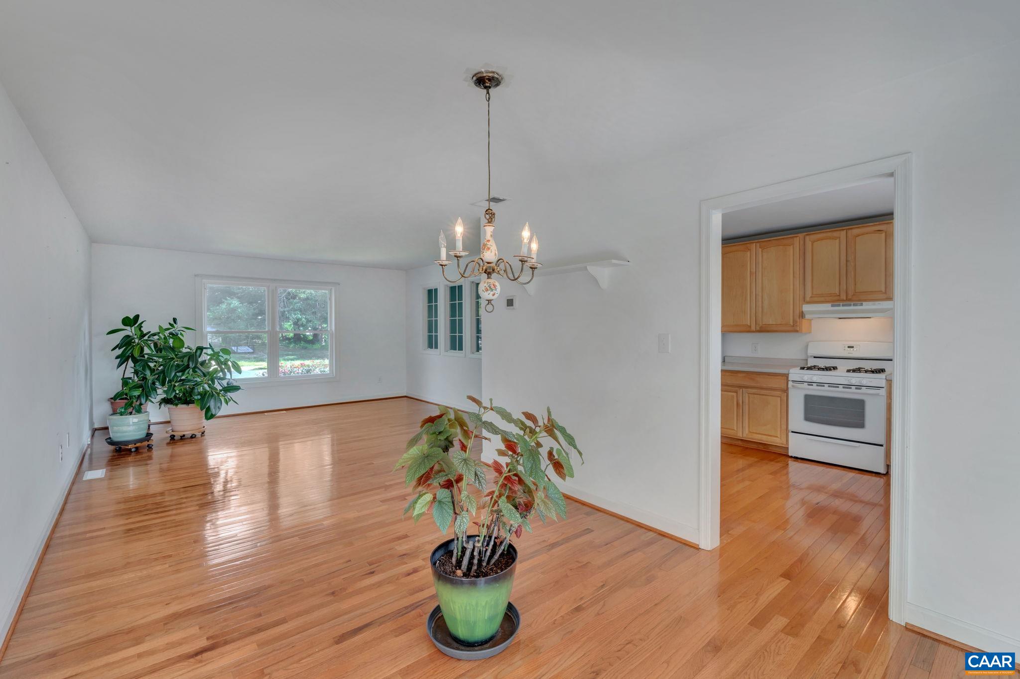392 Minor Ridge Road Charlottesville, VA 22901 - Photo 13 of 47 a view of a kitchen and dining room with wooden floor