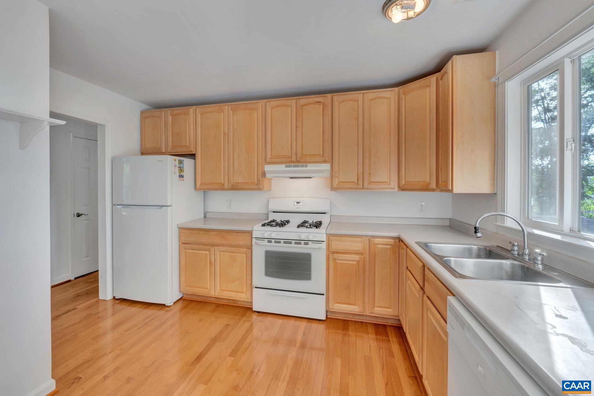 392 Minor Ridge Road Charlottesville, VA 22901 - Photo 14 of 47 a kitchen with a sink stove and refrigerator