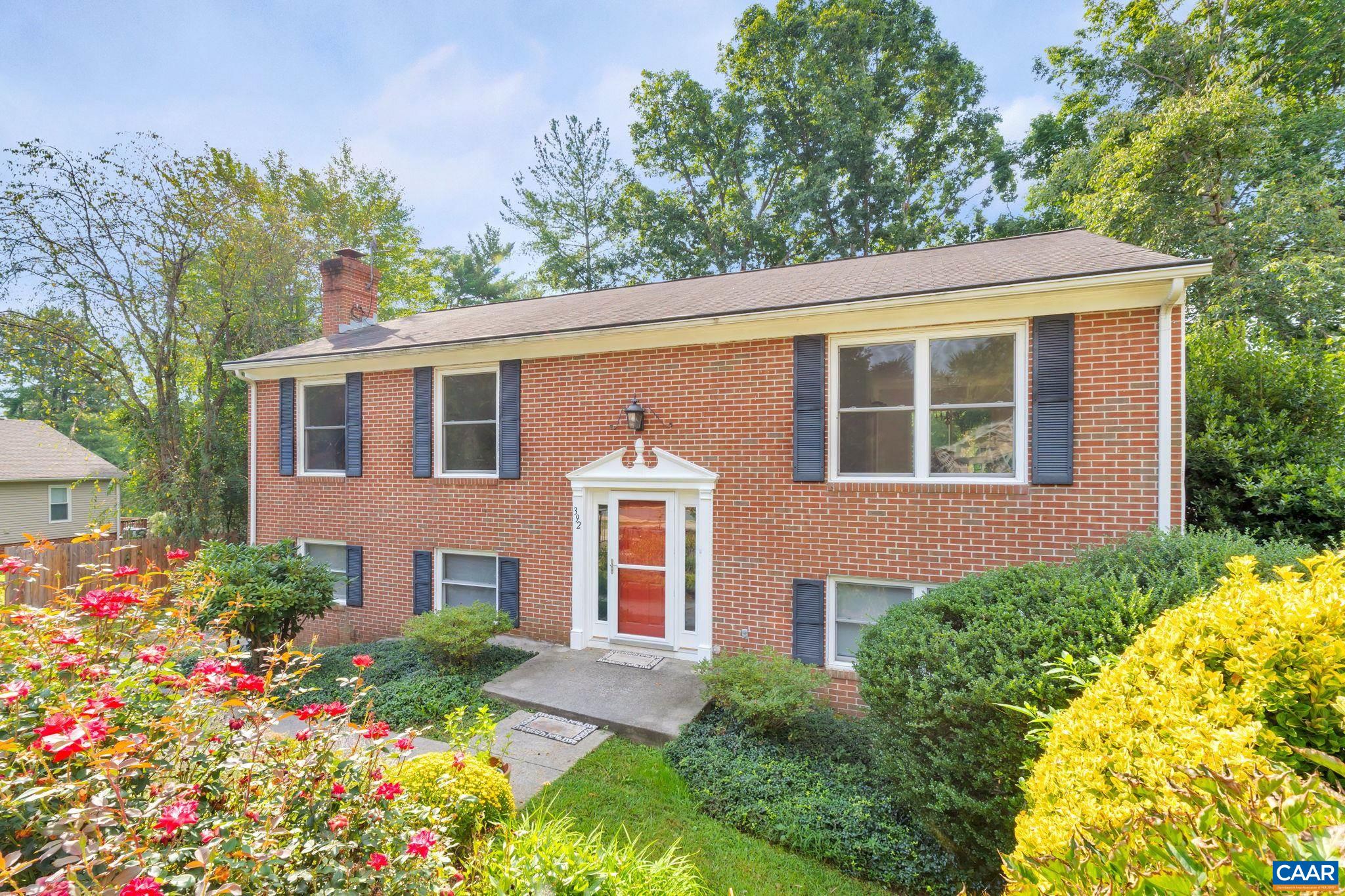 392 Minor Ridge Road Charlottesville, VA 22901 - Photo 2 of 47 a front view of a house with a yard