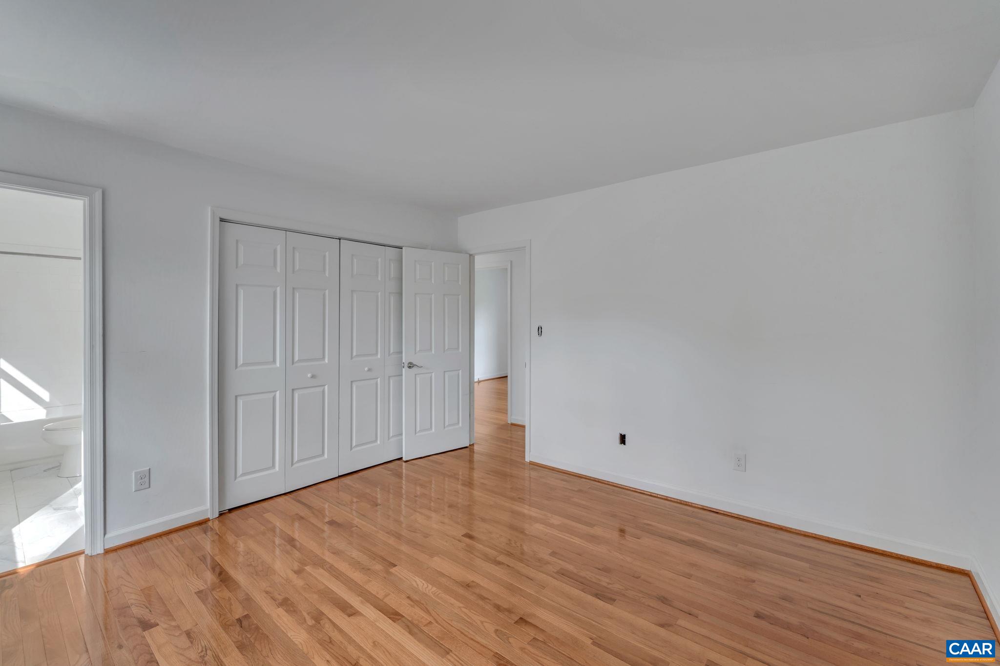 392 Minor Ridge Road Charlottesville, VA 22901 - Photo 23 of 47 a view of an empty room with wooden floor