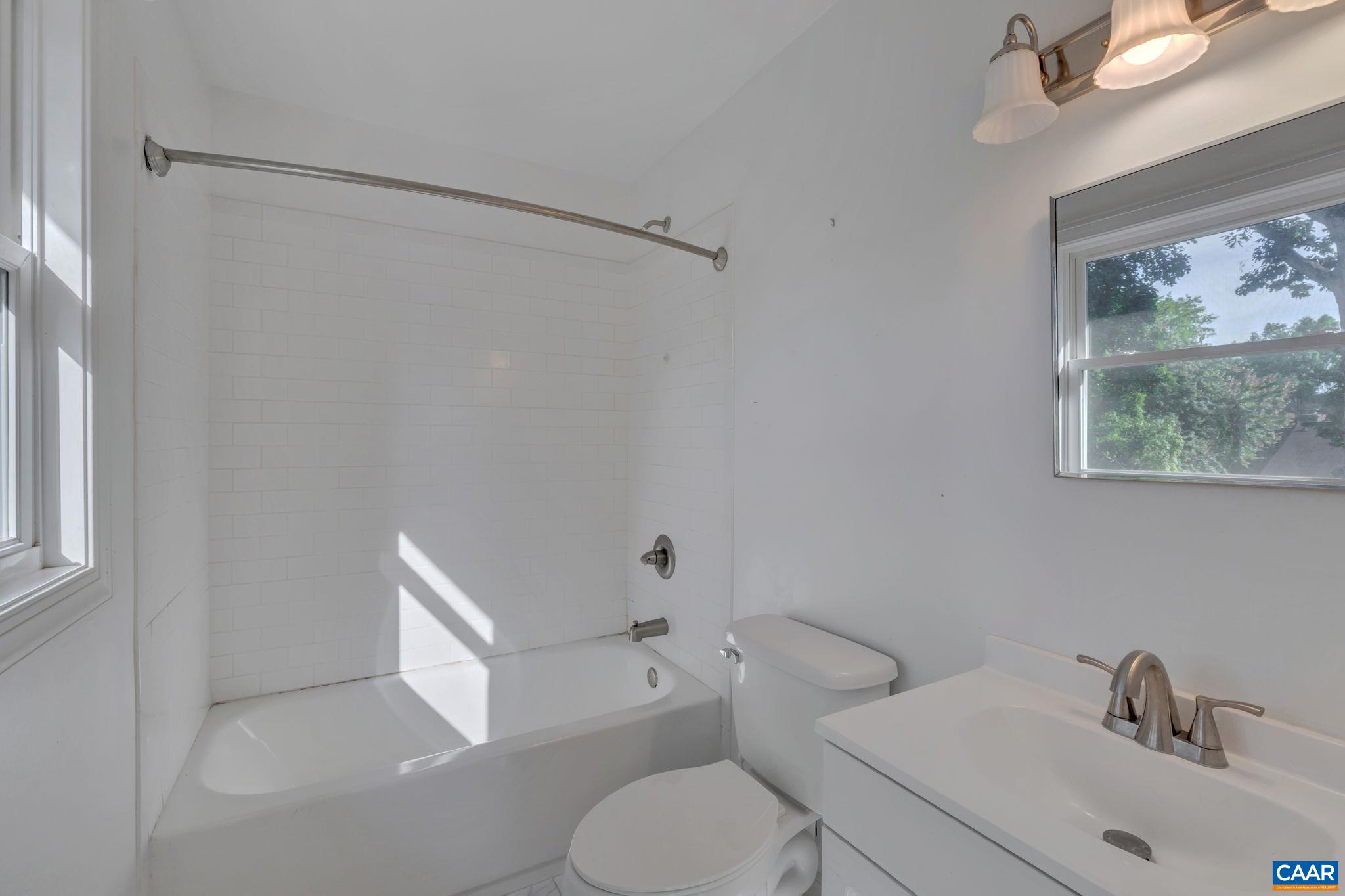 392 Minor Ridge Road Charlottesville, VA 22901 - Photo 24 of 47 a white toilet sitting next to a bathroom sink