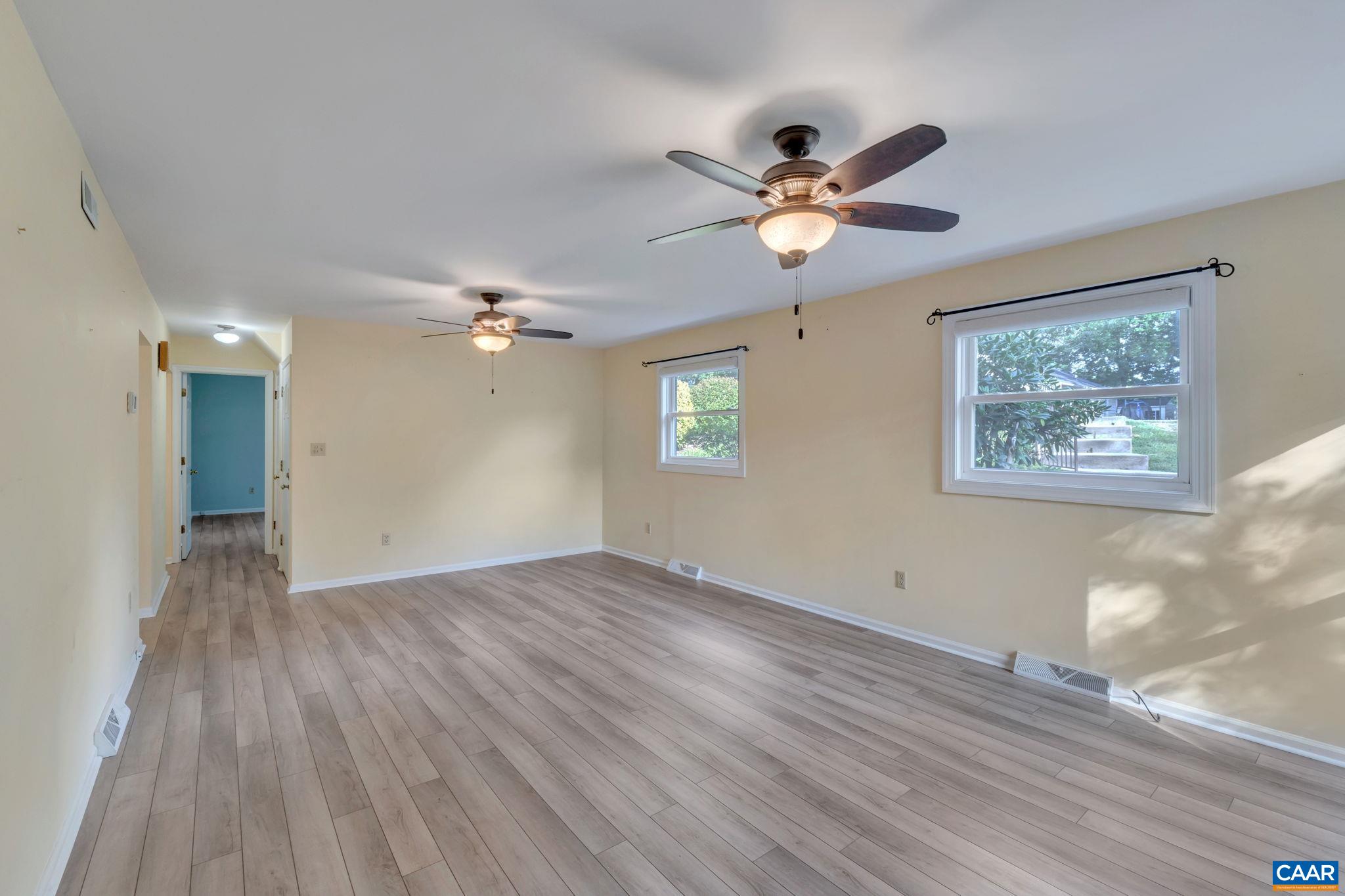 392 Minor Ridge Road Charlottesville, VA 22901 - Photo 29 of 47 a view of empty room with wooden floor and fan