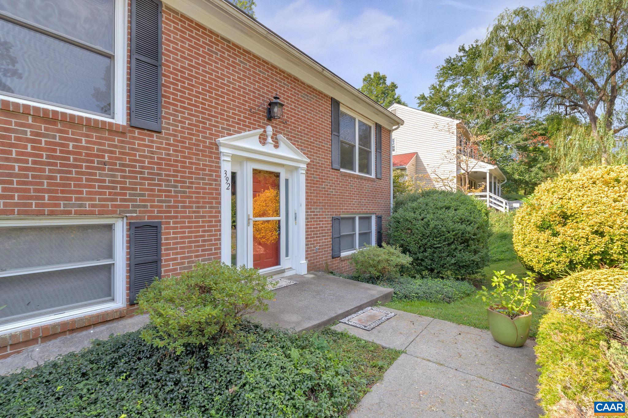 392 Minor Ridge Road Charlottesville, VA 22901 - Photo 3 of 47 a front view of a house with garden