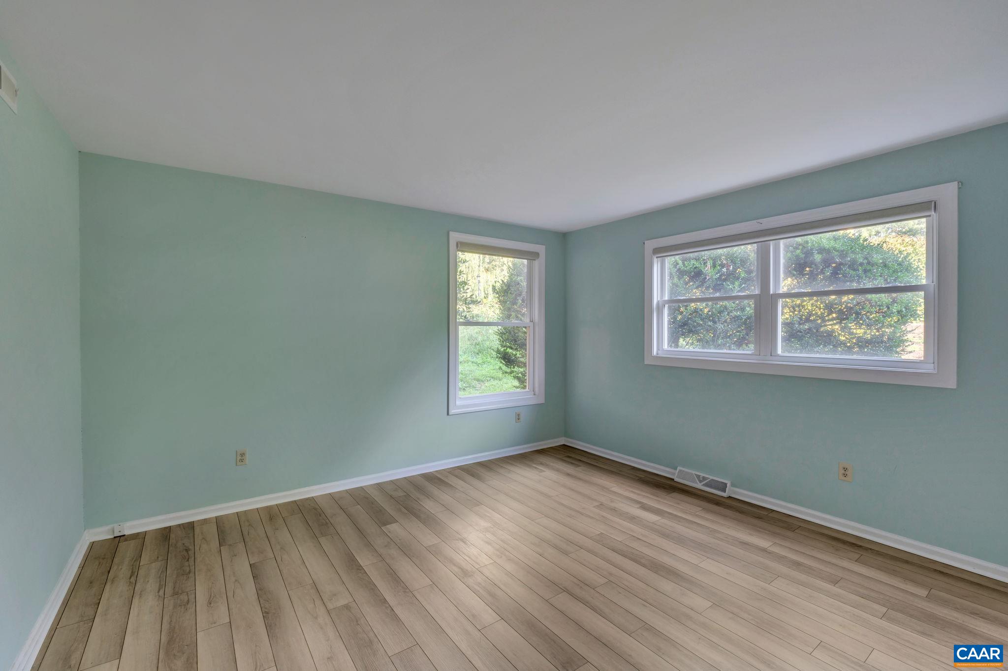 392 Minor Ridge Road Charlottesville, VA 22901 - Photo 31 of 47 a view of a room with wooden floor and window