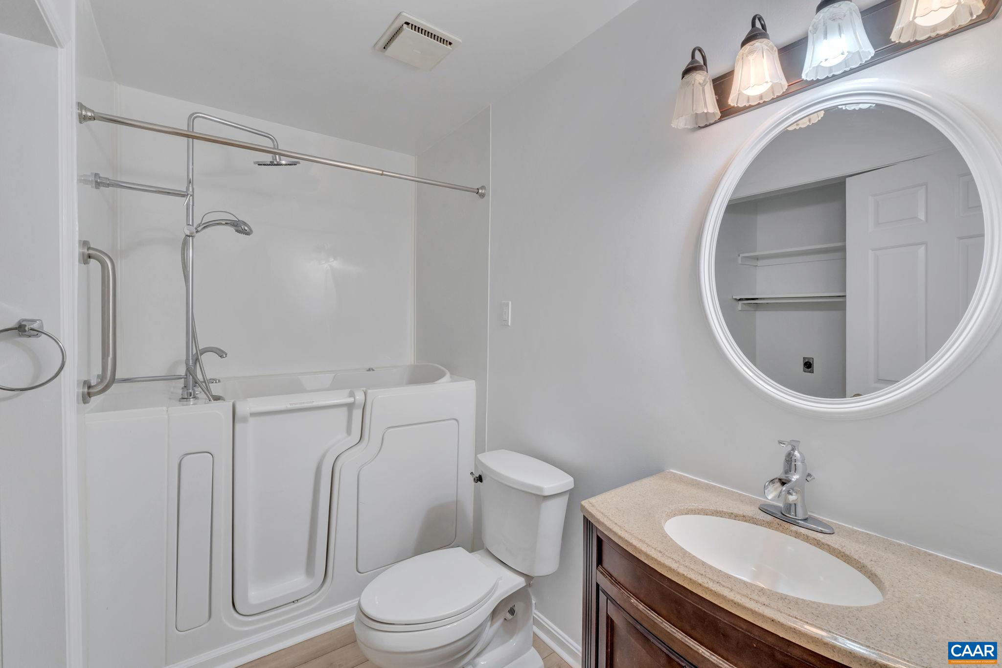392 Minor Ridge Road Charlottesville, VA 22901 - Photo 33 of 47 a bathroom with a sink a toilet and a mirror