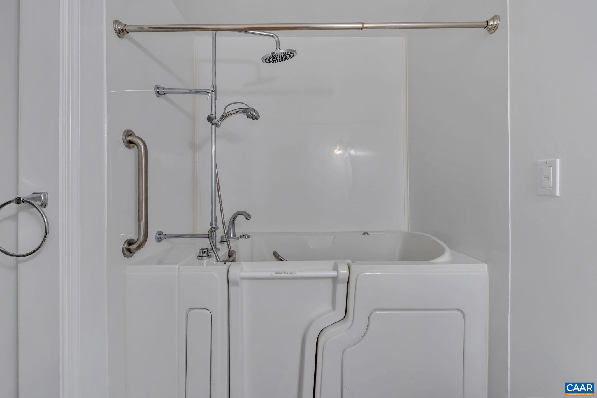 392 Minor Ridge Road Charlottesville, VA 22901 - Photo 34 of 47 a bathroom with a shower a sink and a mirror