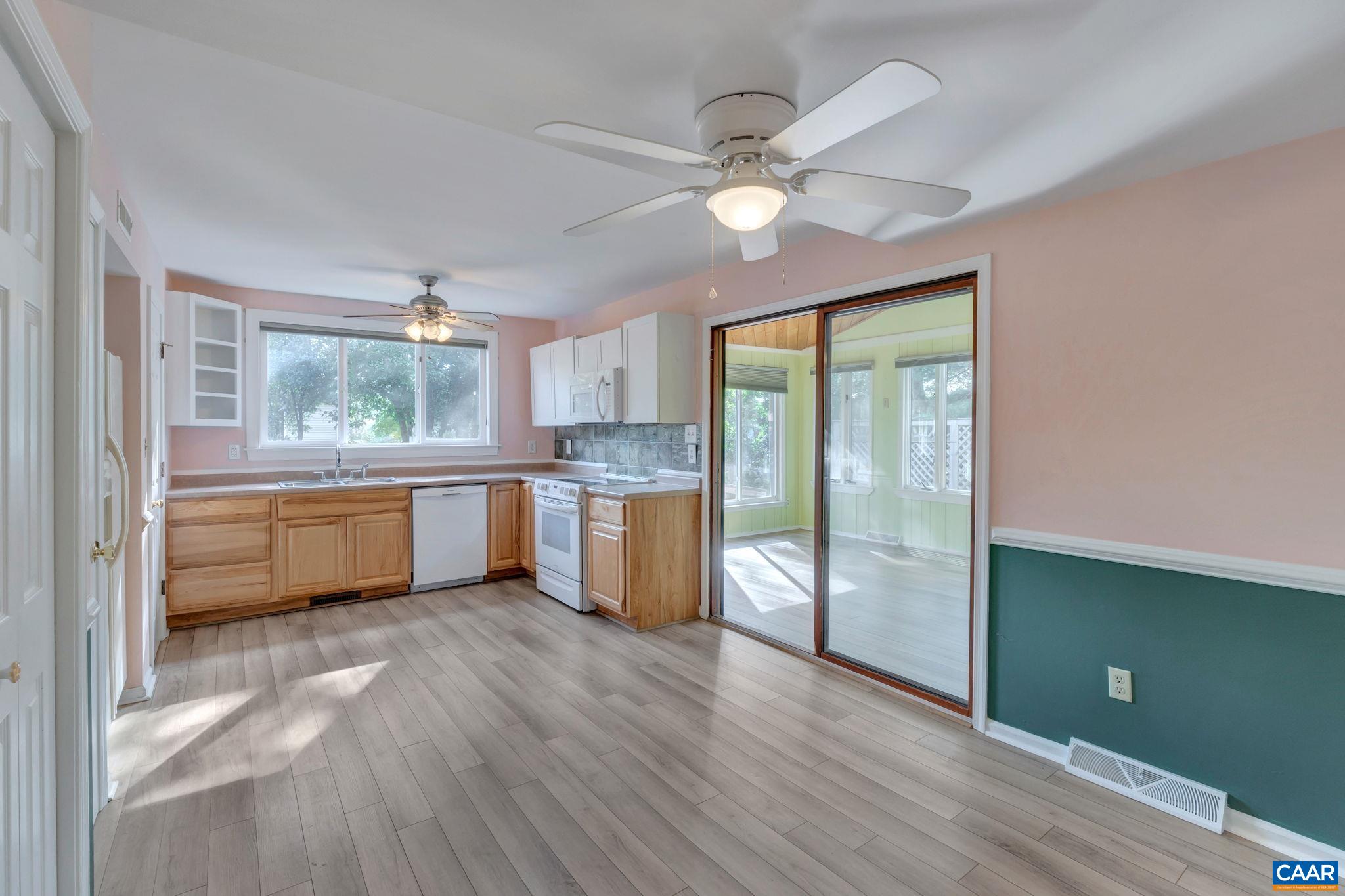 392 Minor Ridge Road Charlottesville, VA 22901 - Photo 36 of 47 a kitchen with white cabinets and white appliances