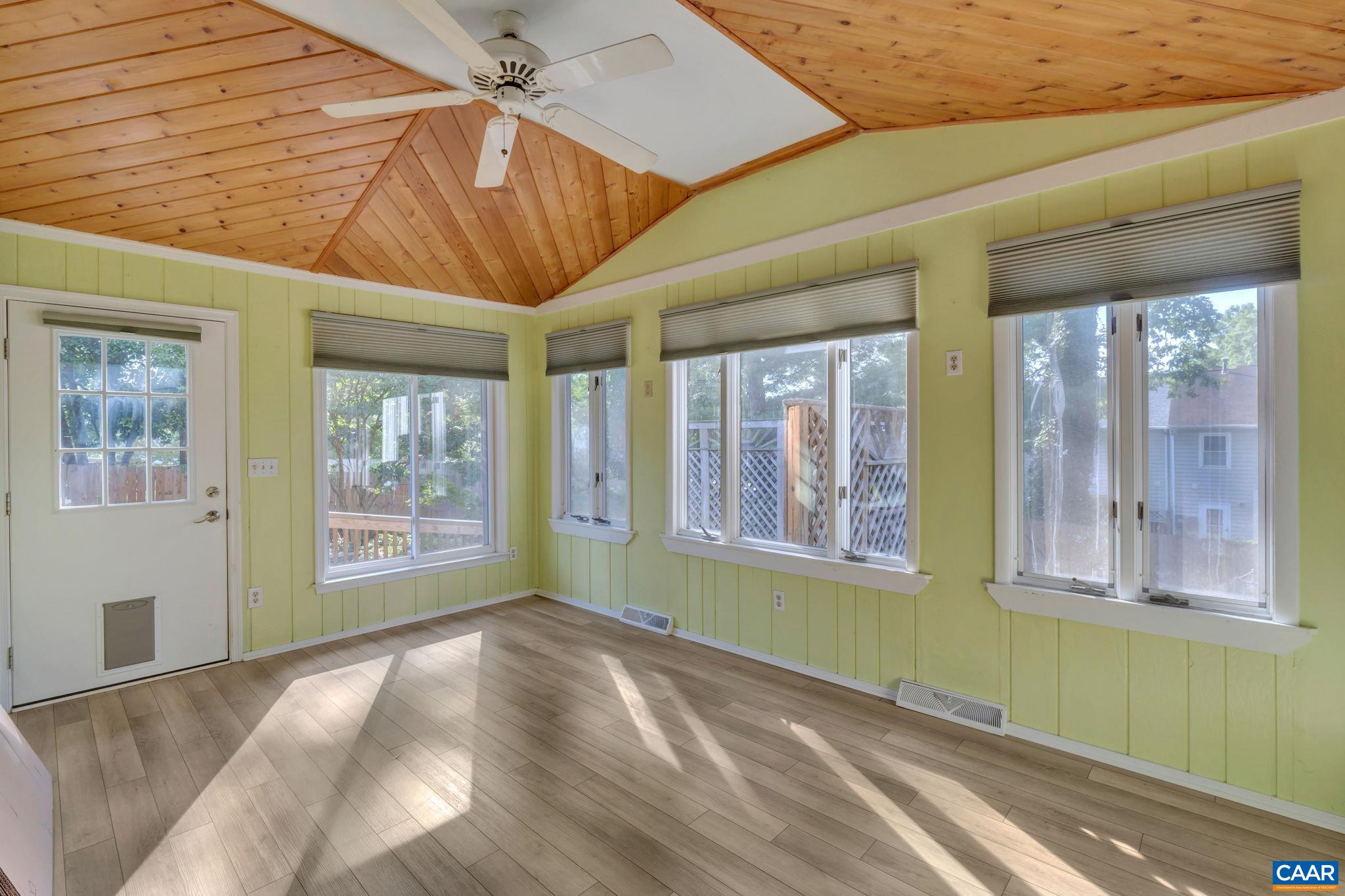 392 Minor Ridge Road Charlottesville, VA 22901 - Photo 41 of 47 a view of an empty room with a window and chandelier